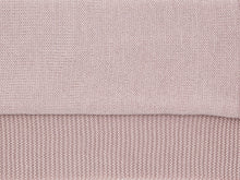 Close-up of the jersey knit and garter stitch border of the pink Tatou baby blanket